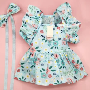 VESTIDO VOLADO EN MANGAS Y MOÑO FLOREADO